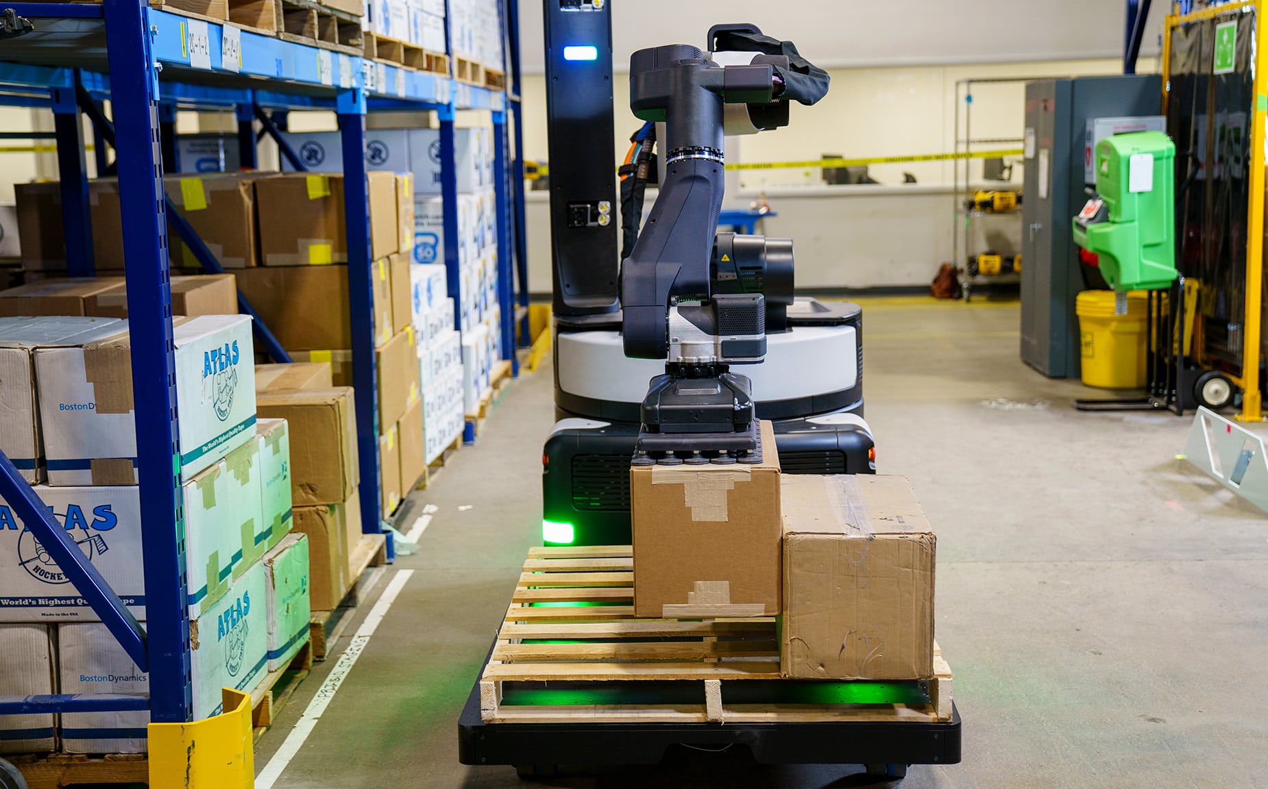 Stretch robot places boxes onto a pallet